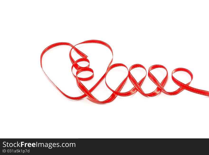 Heart from a red ribbon separately on a white background