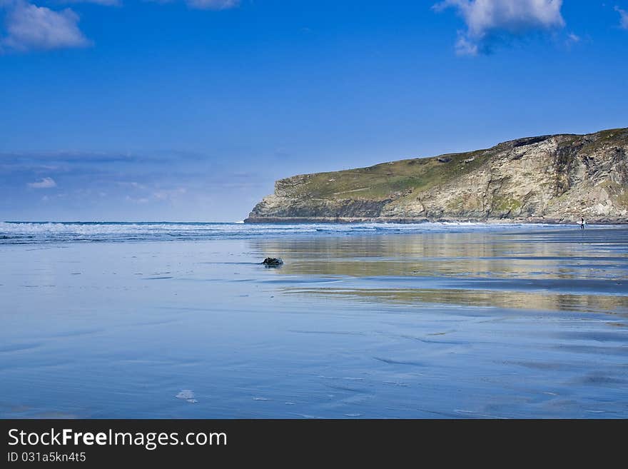 Taken at Trebarwith Strand, Cornwall looking towards Penhallic Point. The surf was breaking leaving some great reflections in the sand