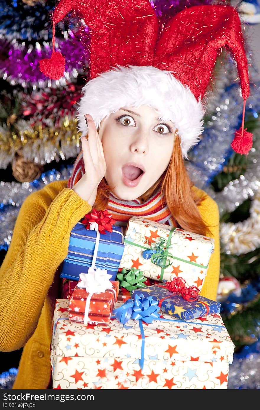 Funny Girl In Christmas Cap With Gift Boxes