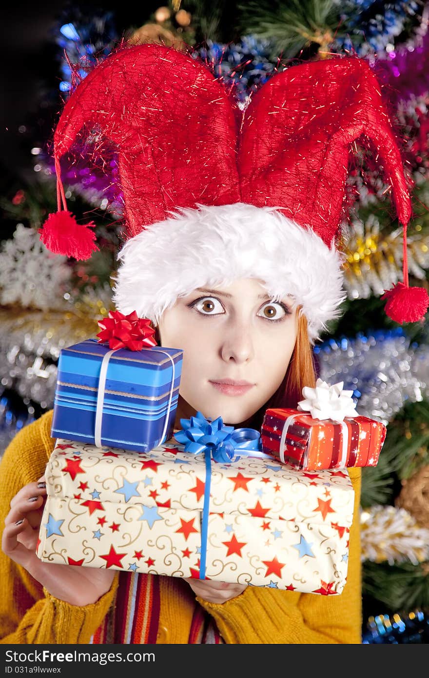 Funny Girl In Christmas Cap With Gift Boxes