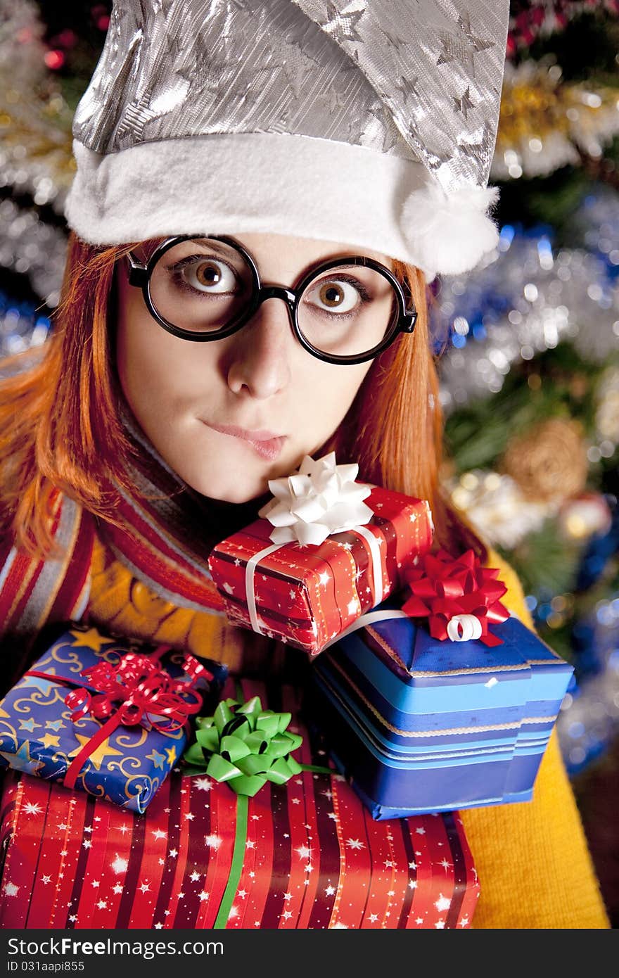 Funny Girl In Christmas Cap With Gift Boxes