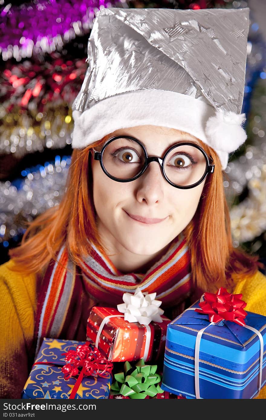 Funny Girl In Christmas Cap With Gift Boxes