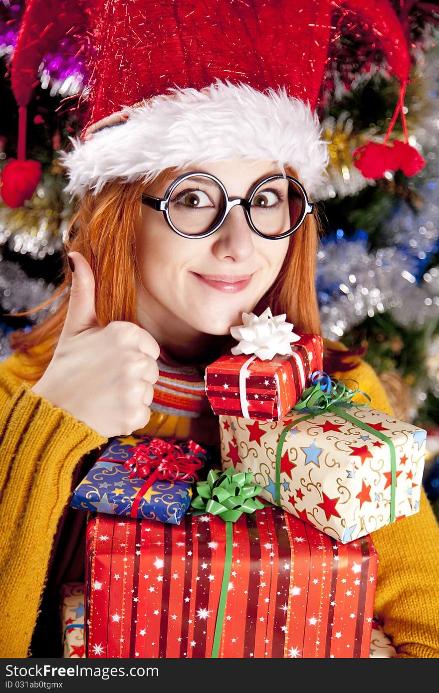 Funny Girl In Christmas Cap With Gift Boxes