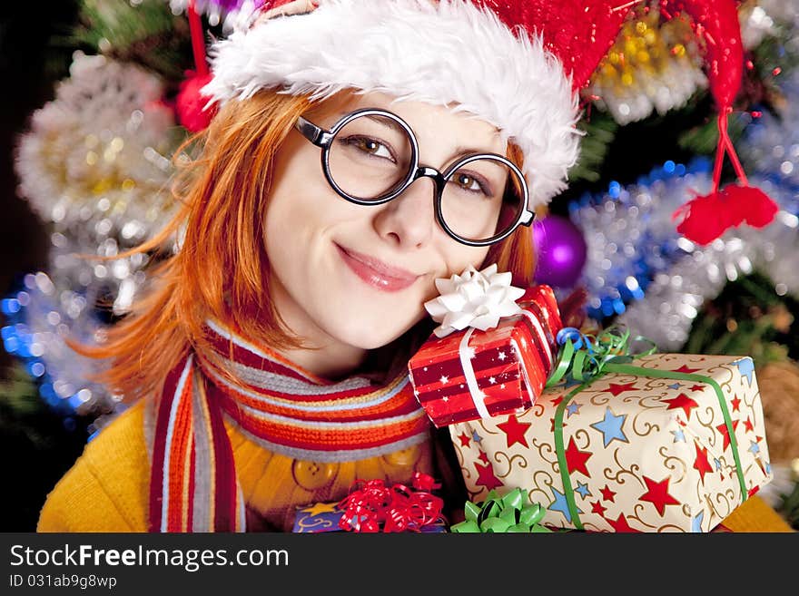 Funny Girl In Christmas Cap With Gift Boxes