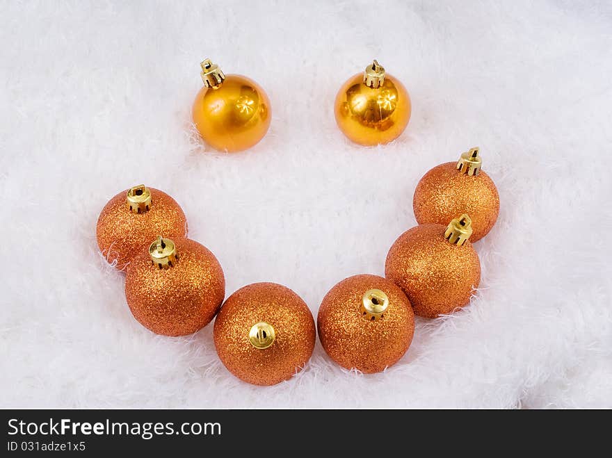 Christmas golden spheres on the white fur. Christmas golden spheres on the white fur