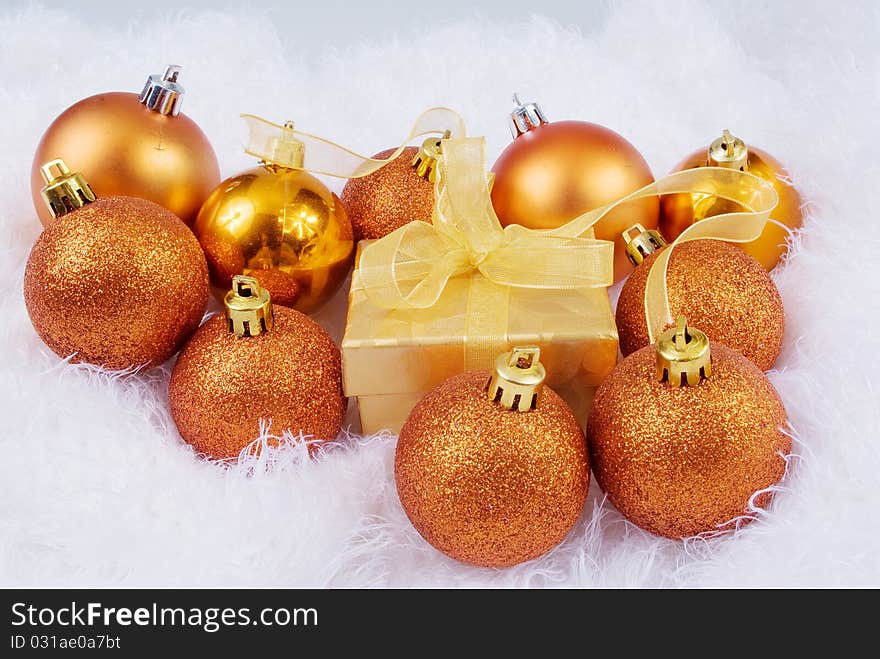 Christmas brightly spheres on the white fur