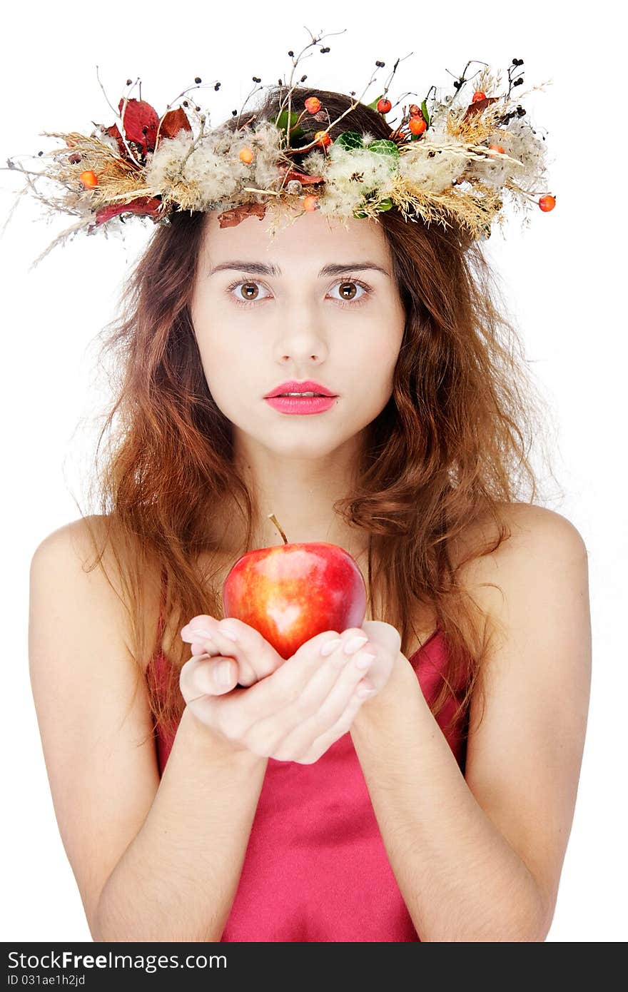 Young beautiful woman with apple over white. Young beautiful woman with apple over white