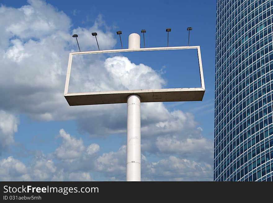 Large blank billboard, and window glass facade office building