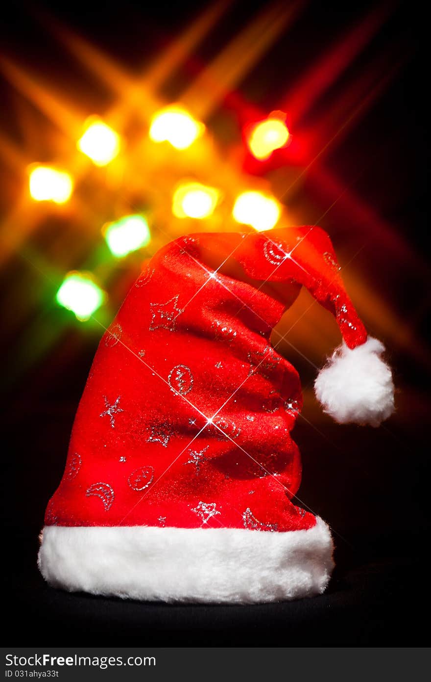 Red Christmas cap with shiny silver ornaments