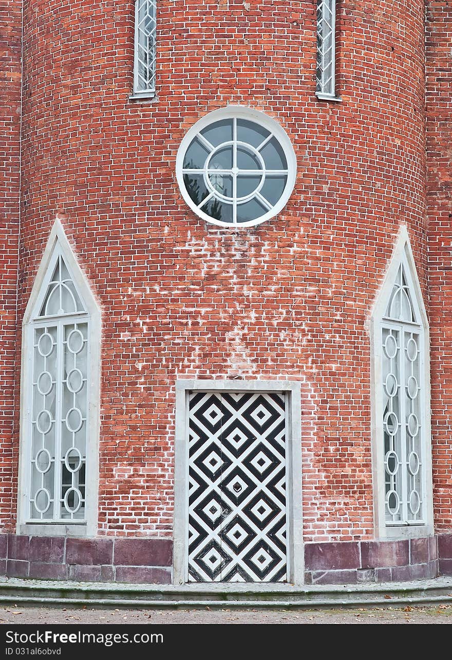 Old door in brick wall with squared pattern. Old door in brick wall with squared pattern