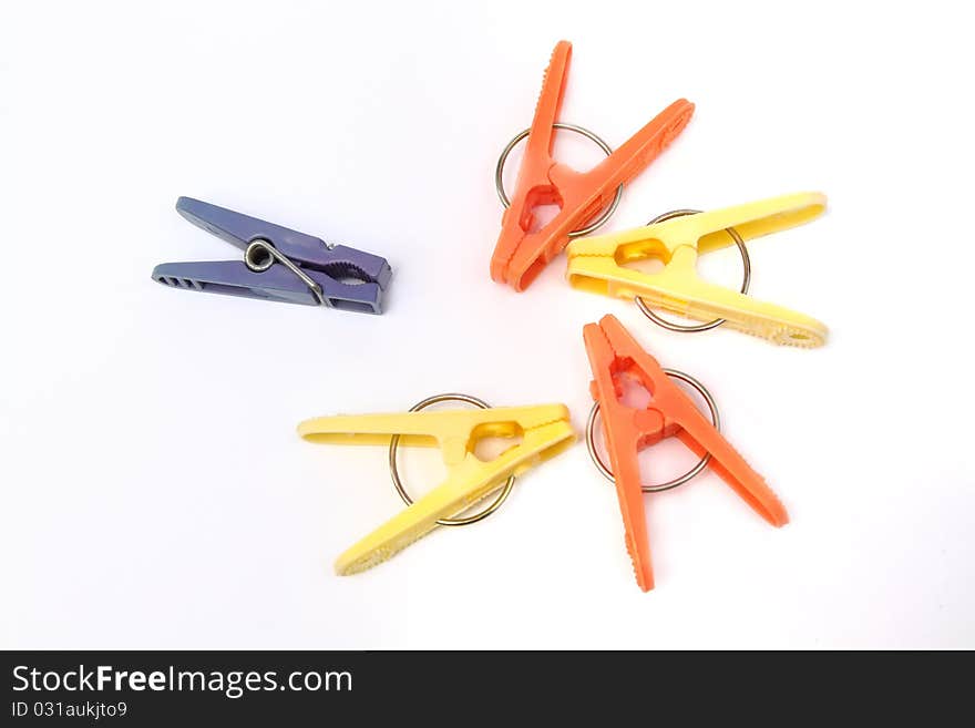 Five colorful clothespins