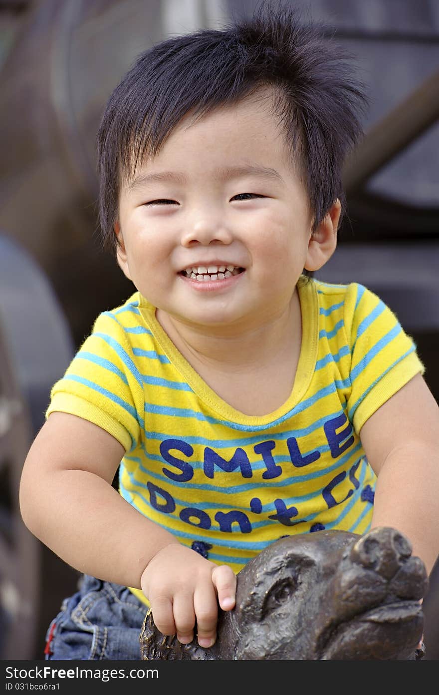 A happy baby is playing