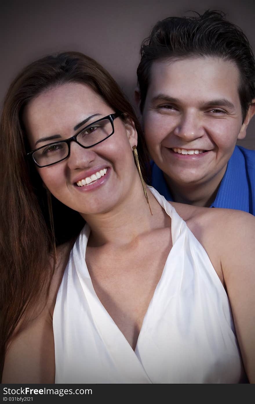 Portrait of a happy Couple smiling to the camera.