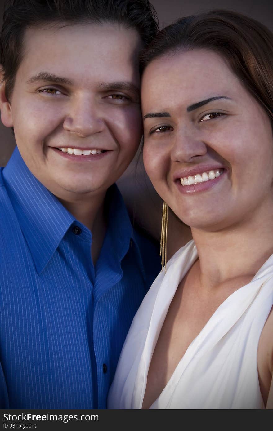 Portrait of a couple smiling and looking to the lens. Portrait of a couple smiling and looking to the lens.