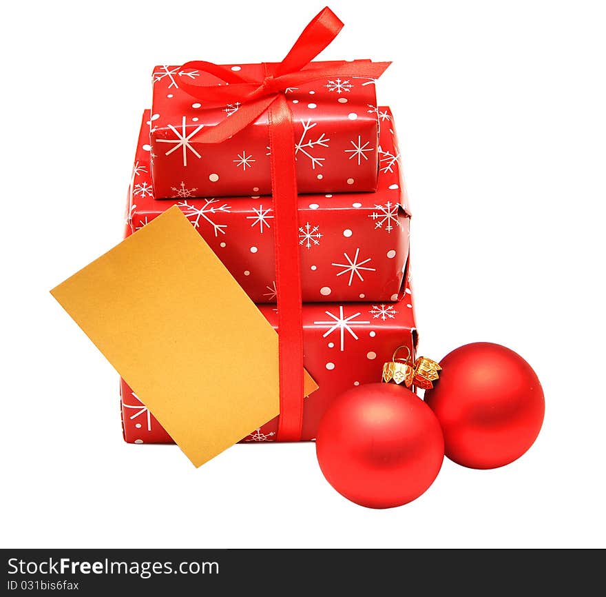 Gift boxes with red balls and card for greeting. Gift boxes with red balls and card for greeting