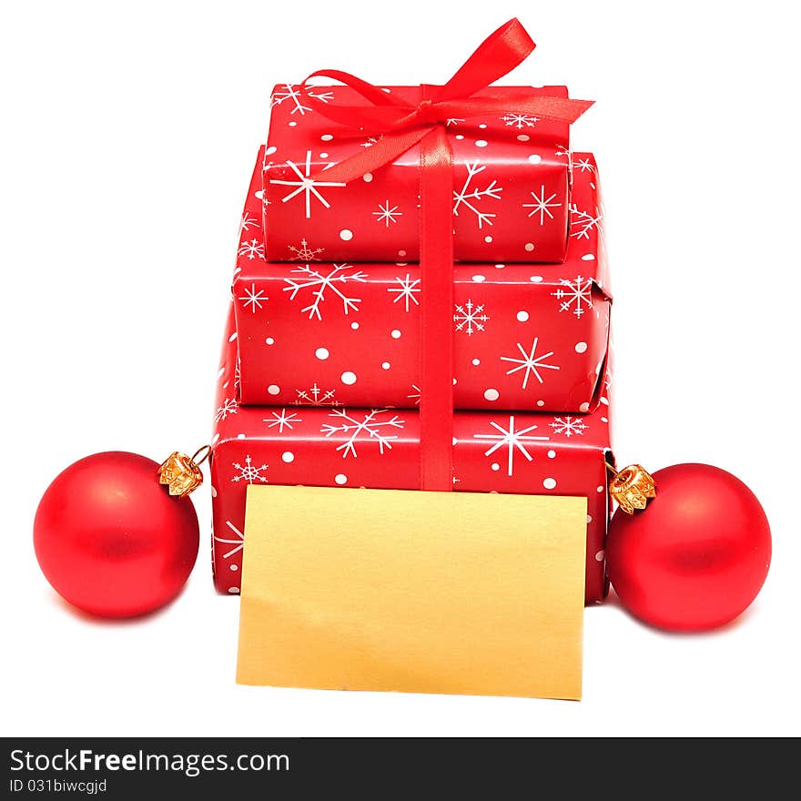 Gift boxes with red balls and card for greeting. Gift boxes with red balls and card for greeting