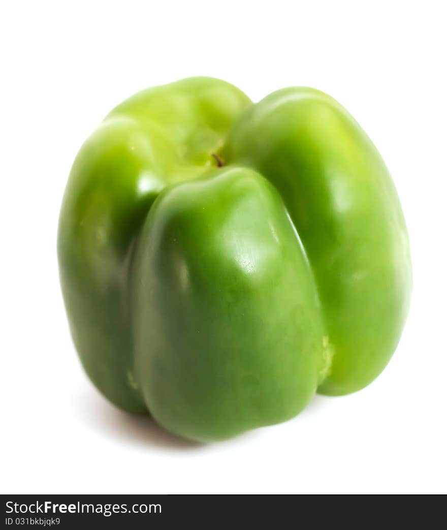 Green pepper upside-down on white background. Green pepper upside-down on white background