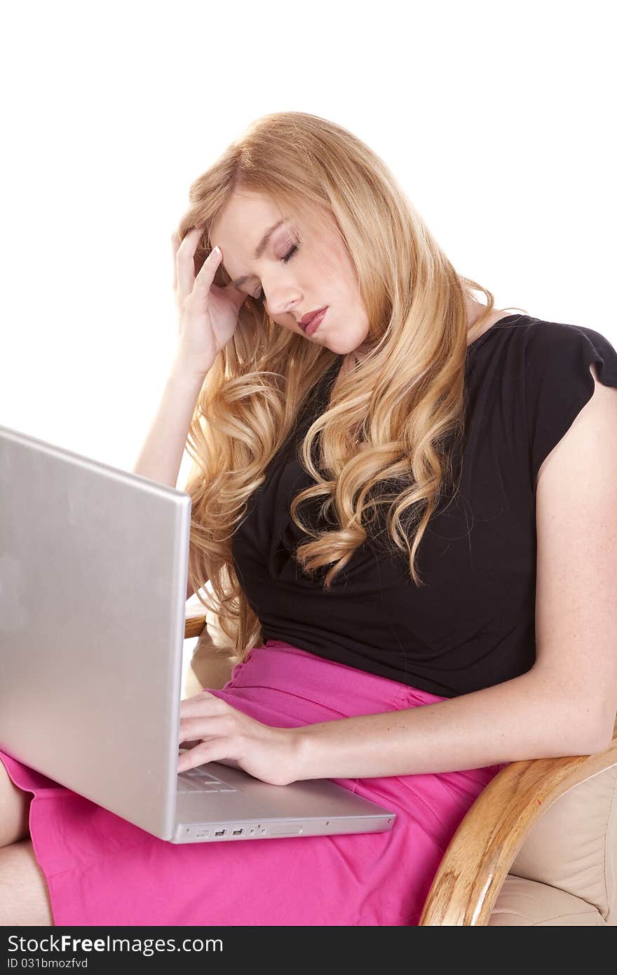 A woman taking a break from her laptop closing her eyes after working for so long. A woman taking a break from her laptop closing her eyes after working for so long.