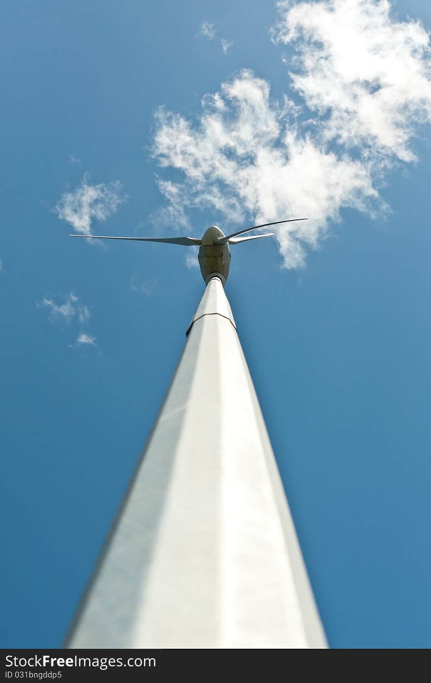 Spinning Windmill With Blue Sky And Clouds