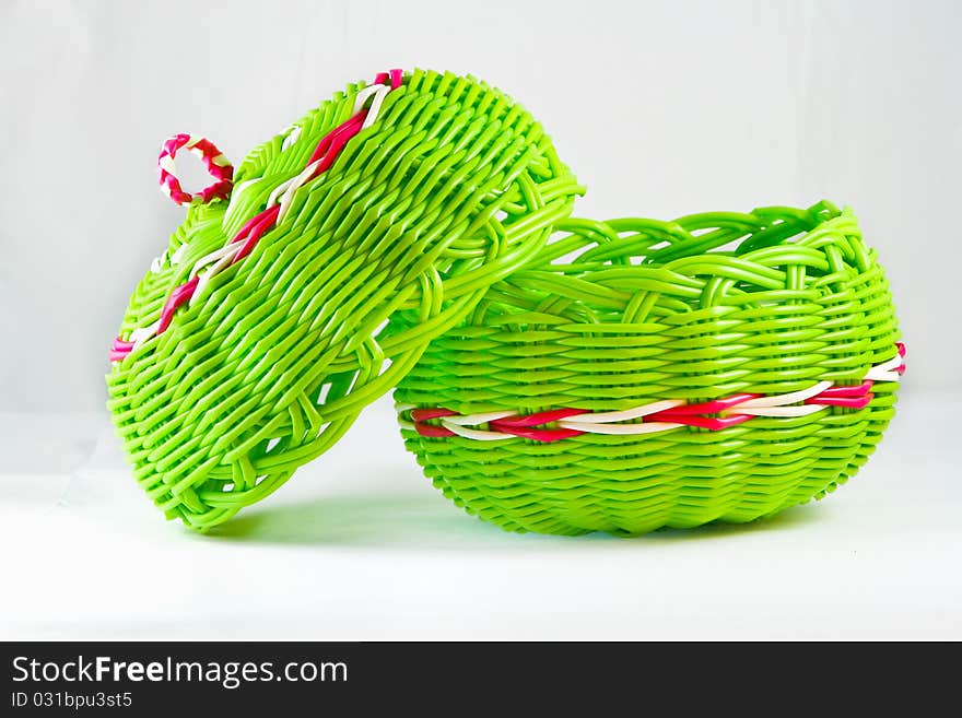 Green empty fruit basket on white background