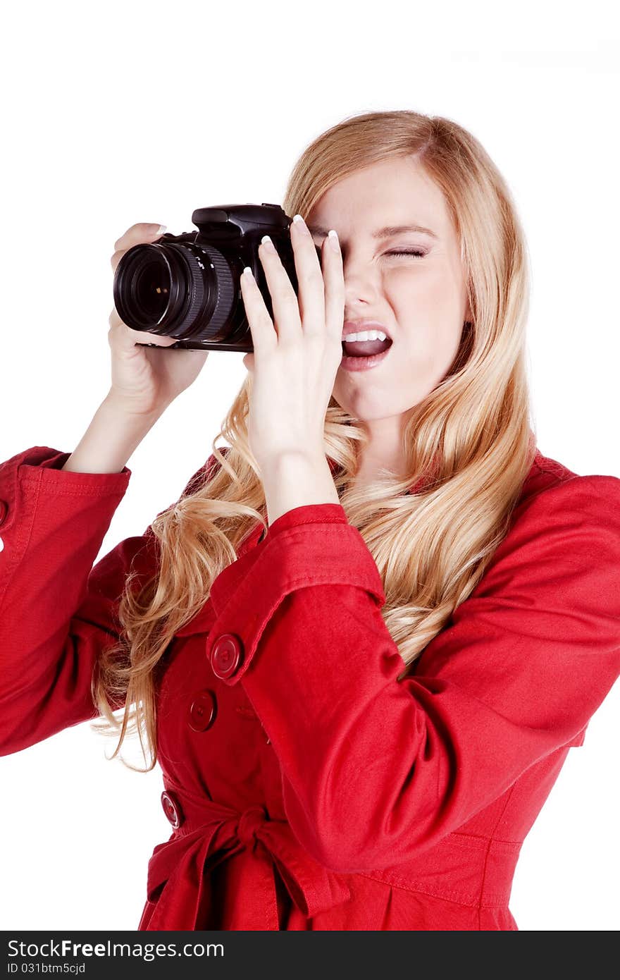 A woman concentrating on taking the perfect picture. A woman concentrating on taking the perfect picture.