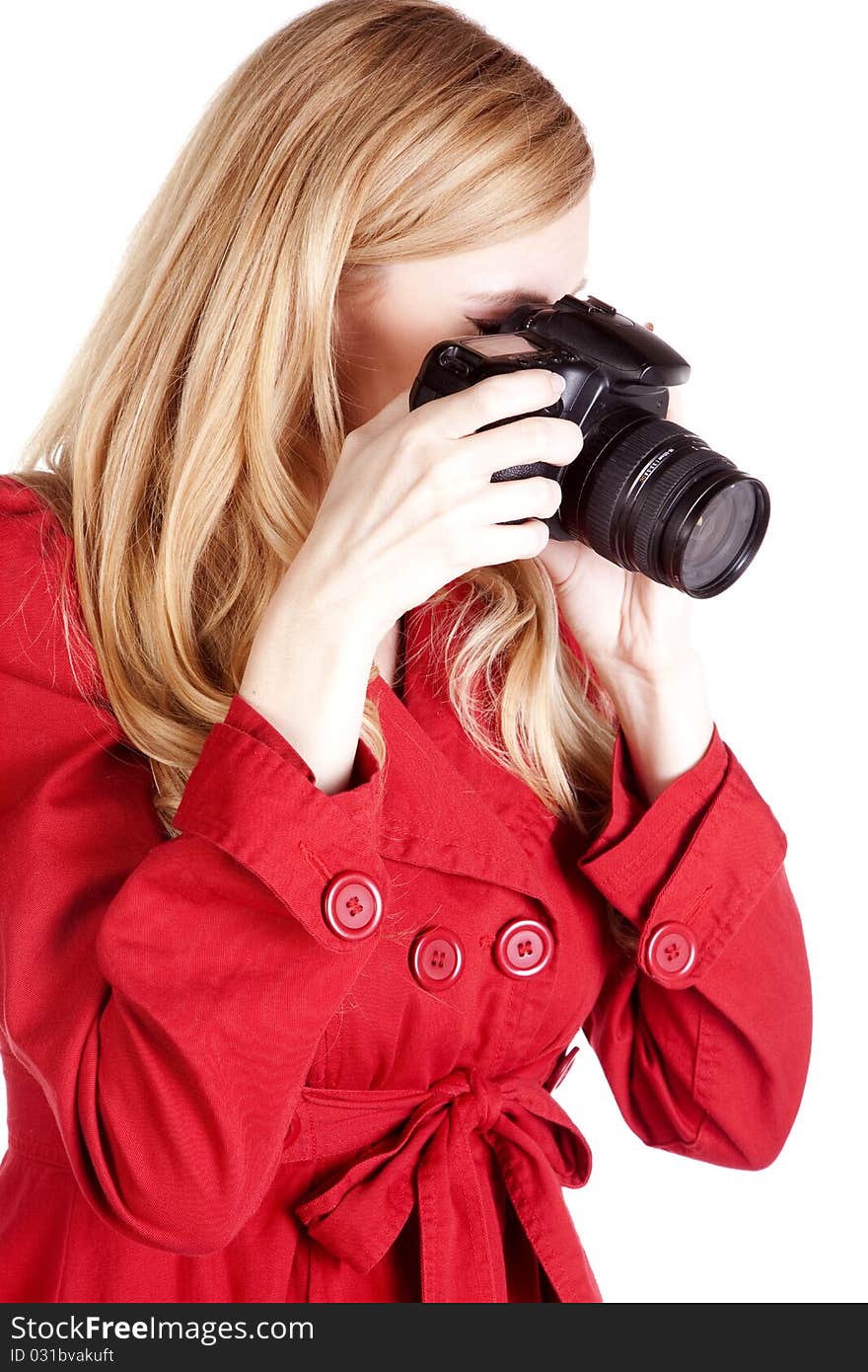 A woman concentrating on taking the perfect picture. A woman concentrating on taking the perfect picture.