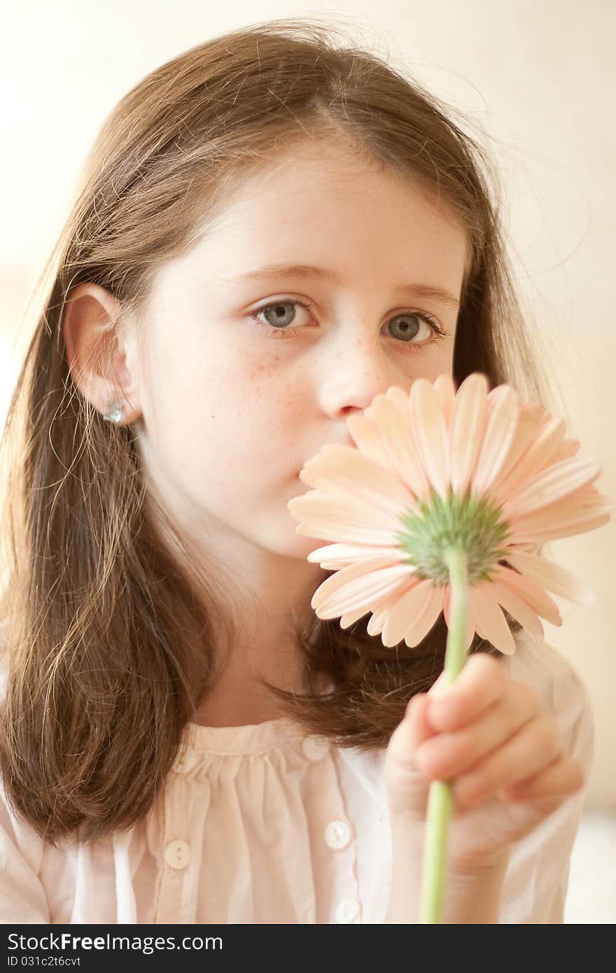 Pretty caucasian girl hold a flower in her hands. Pretty caucasian girl hold a flower in her hands