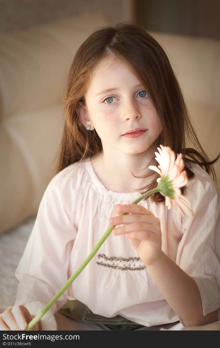 Pretty caucasian girl hold a flower in her hands. Pretty caucasian girl hold a flower in her hands