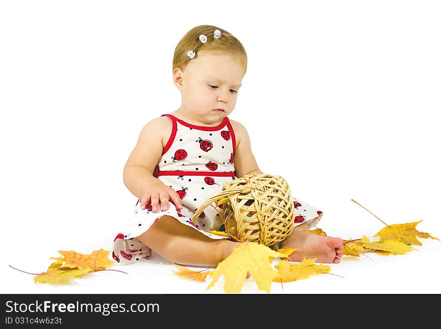 Little girl playing with leaves