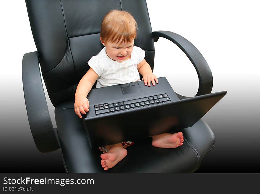 Little girl looking into a laptop. Little girl looking into a laptop