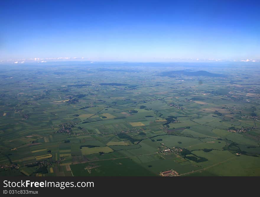 View from flying aircraft above clouds