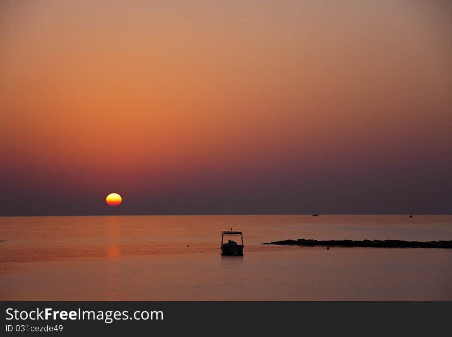 Boat , sunset at beach in Cyprus