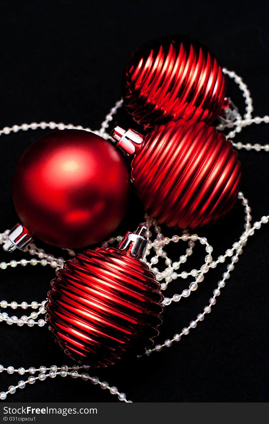 Christmas red toys (spheres) on black. Christmas red toys (spheres) on black