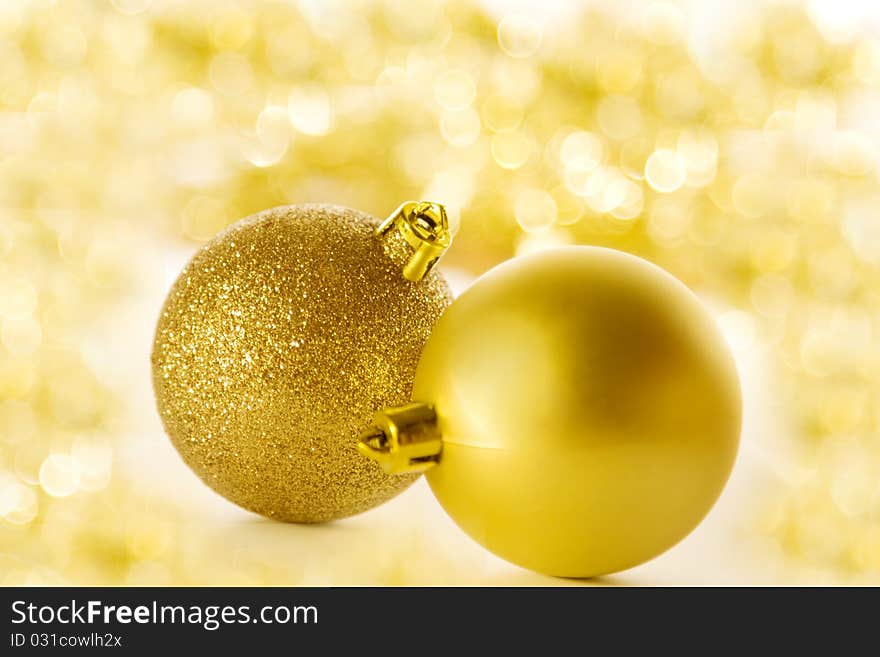 Christmas balls on blurred golden background. Christmas balls on blurred golden background