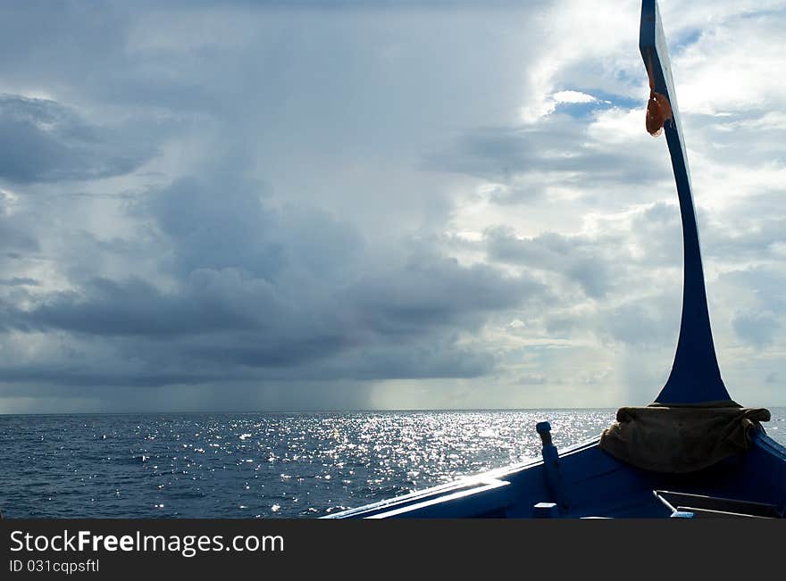 Maldivian boat on the ocean in an overcast day