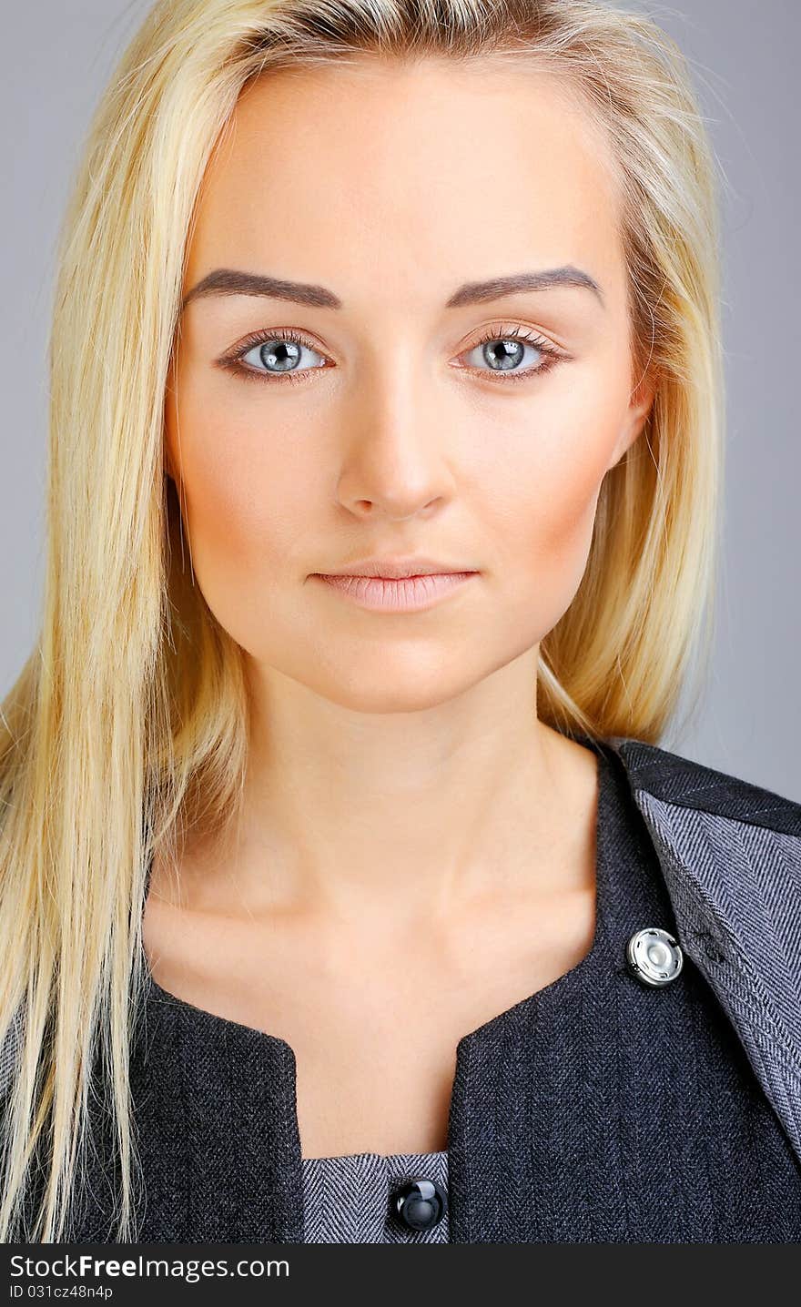 Beautiful model posing on grey background