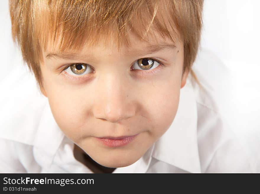 Photo of adorable young boy looking at camera. Photo of adorable young boy looking at camera