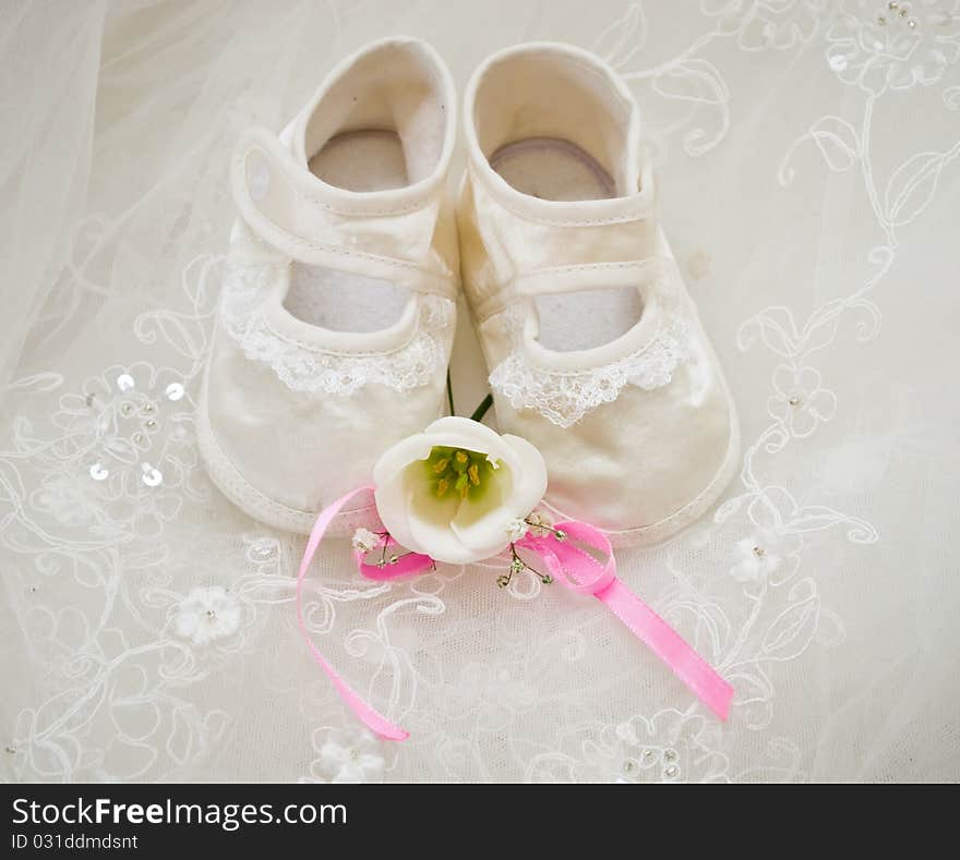 Baby's shoe, on light background