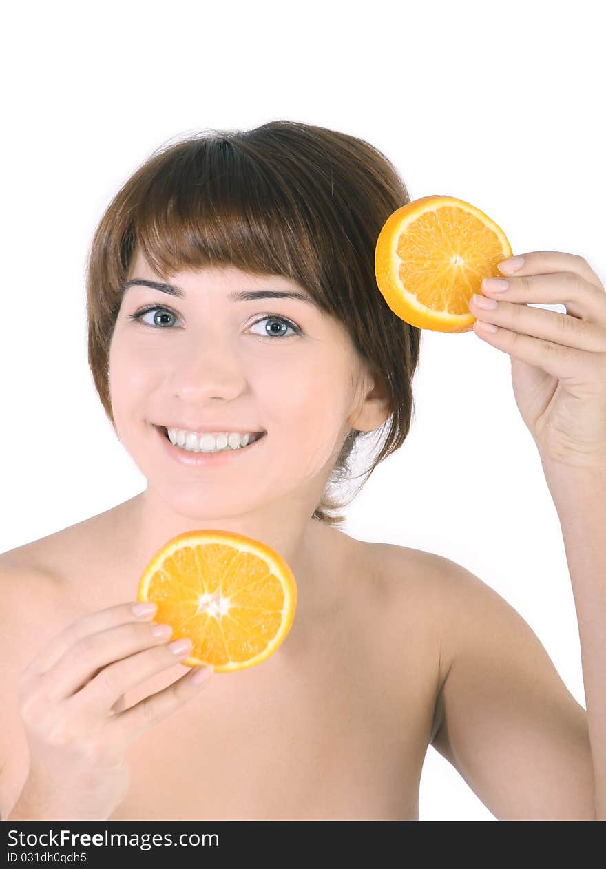 Beautiful girl with two pieces of the orange