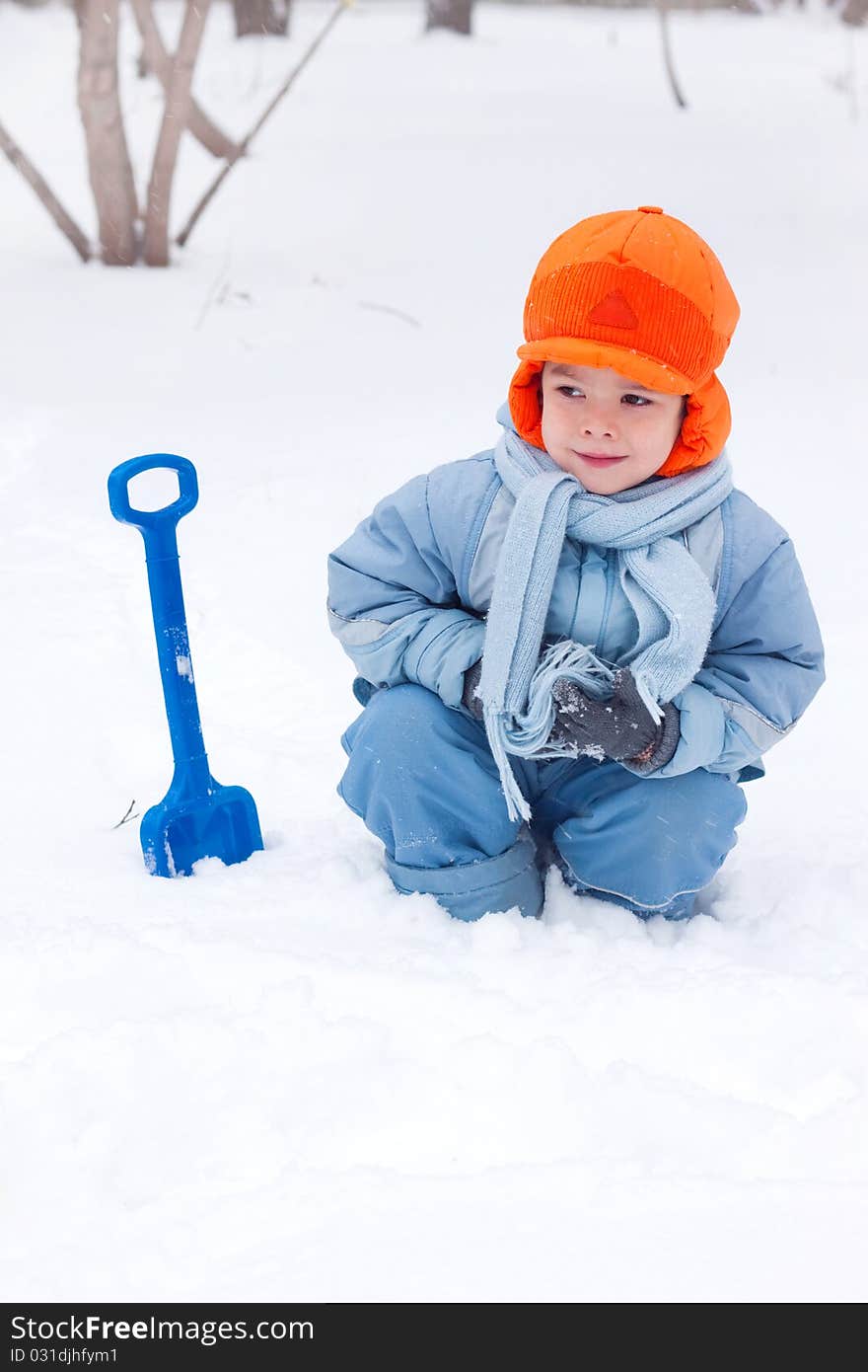 Little Boy Playing, Digs Snow