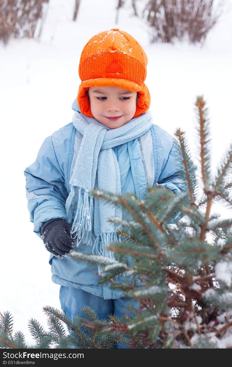 Little boy playing snowballs