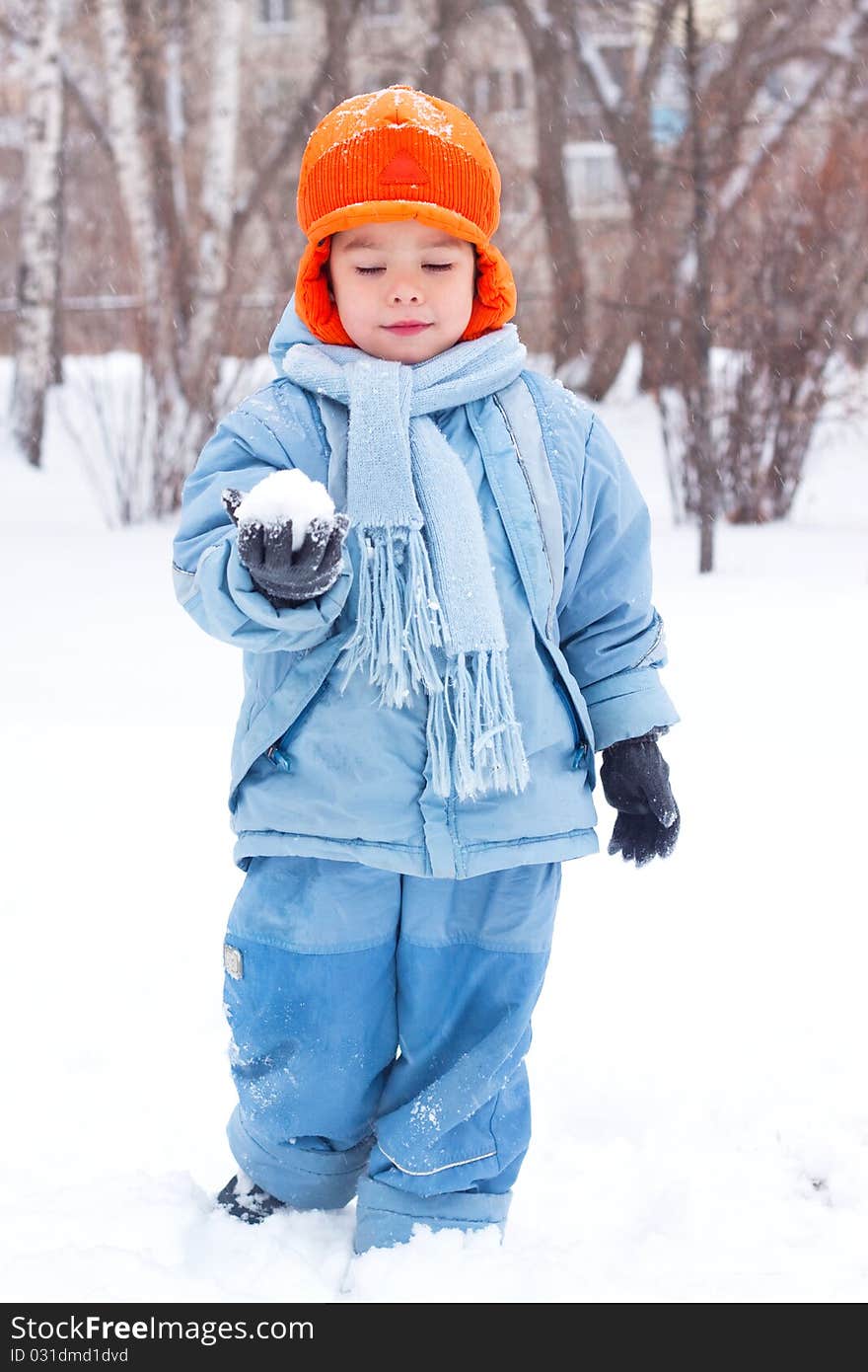 Little Boy Playing Snowballs