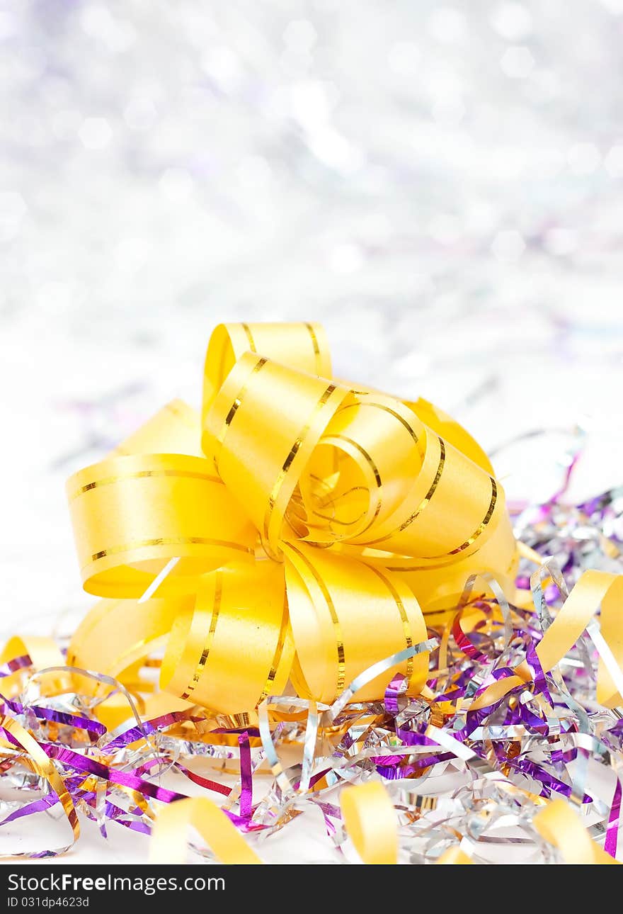 Yellow Christmas ribbon on white background