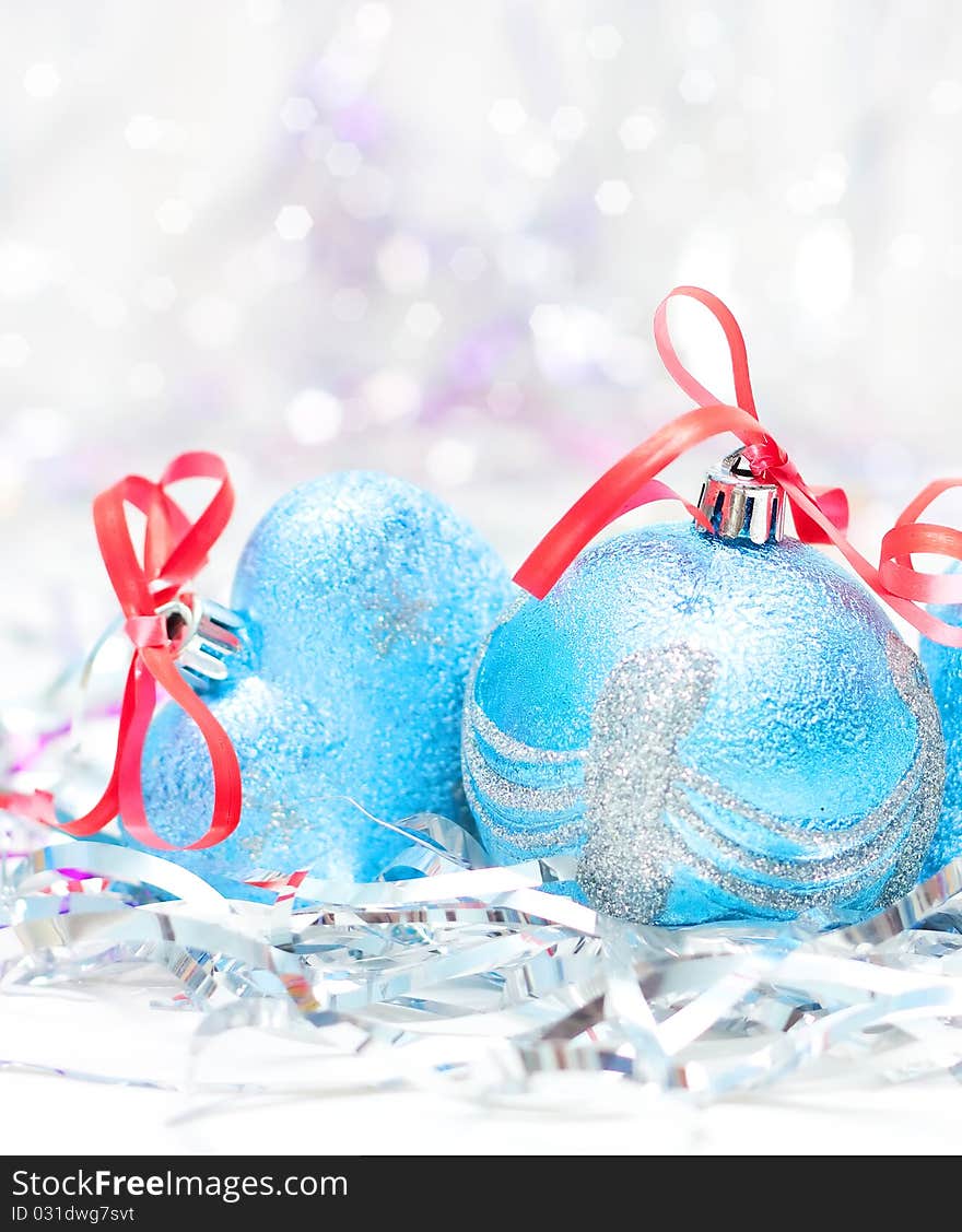 Blue Christmas balls on bright background