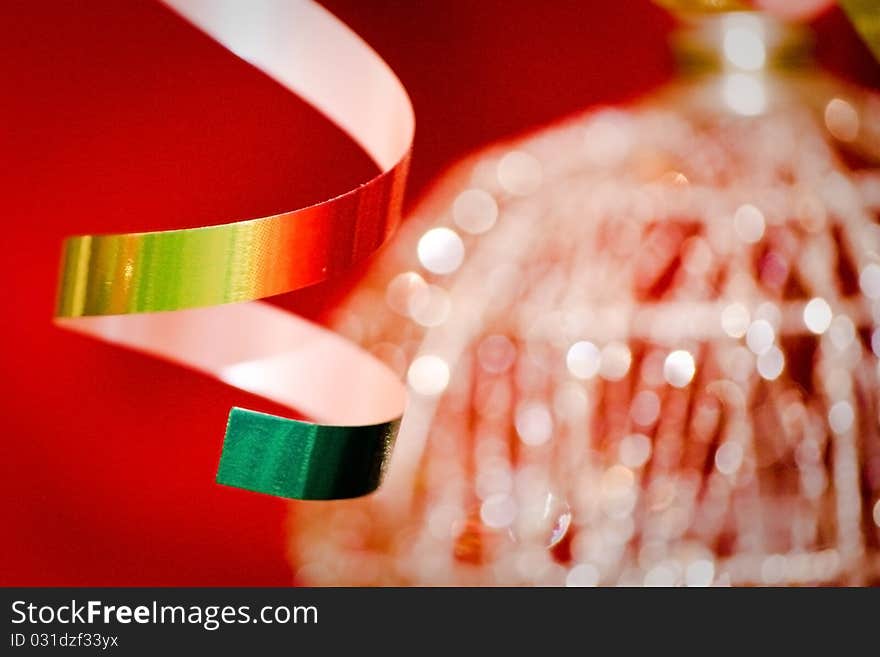 Golden christmas-tree tinsel over red. Abstract, bokeh. Golden christmas-tree tinsel over red. Abstract, bokeh