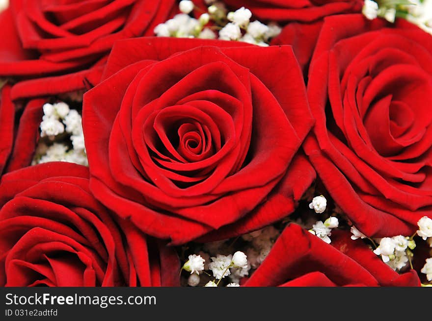 Detail of red roses on a wedding bouquet