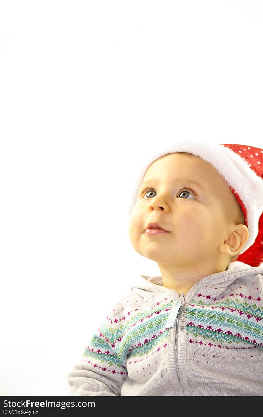 Baby in red hat  on a white buckground