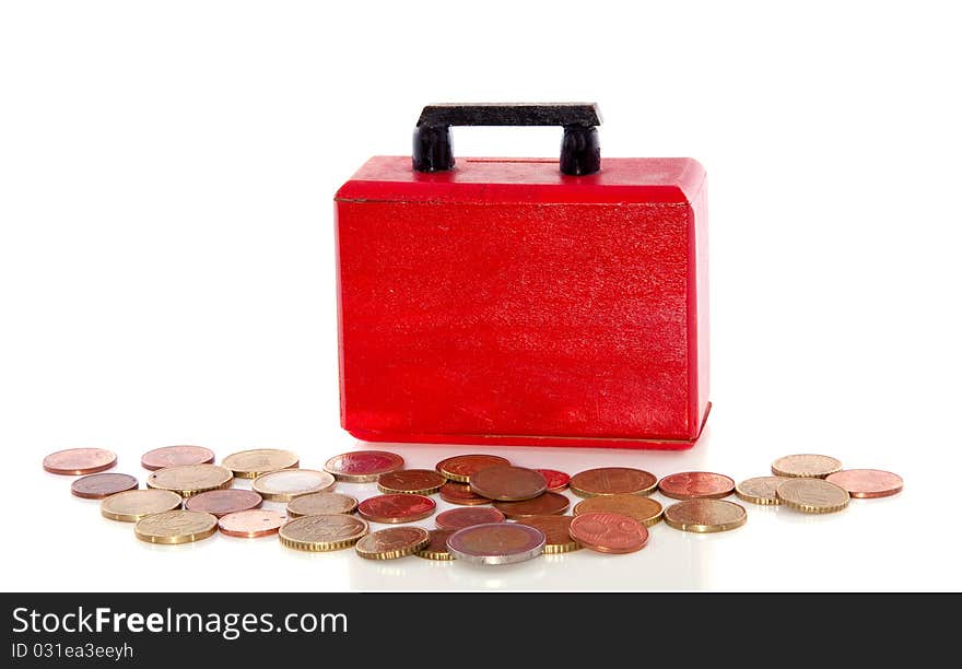 Euro coins in front of a briefcase isolated over white. Euro coins in front of a briefcase isolated over white