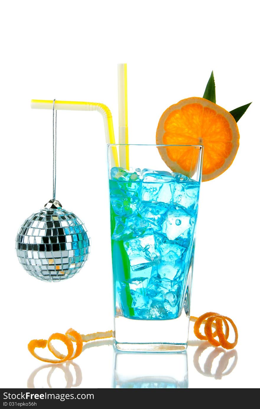 Blue Hawaii cocktail with malibu rum, blue curacao, pineapple juice, lime juice, orange wheel and disco sphere isolated on a white background. Blue Hawaii cocktail with malibu rum, blue curacao, pineapple juice, lime juice, orange wheel and disco sphere isolated on a white background