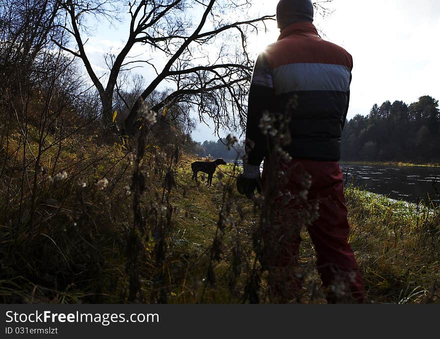 Young guy with dog. Photo.